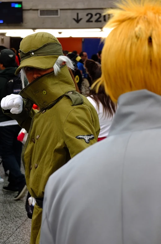 a man wearing a green jacket with orange hair