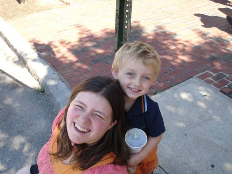 a mother and child pose for a picture