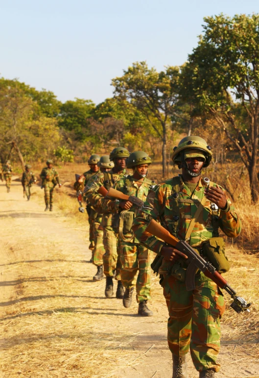 a group of soldiers on a country road