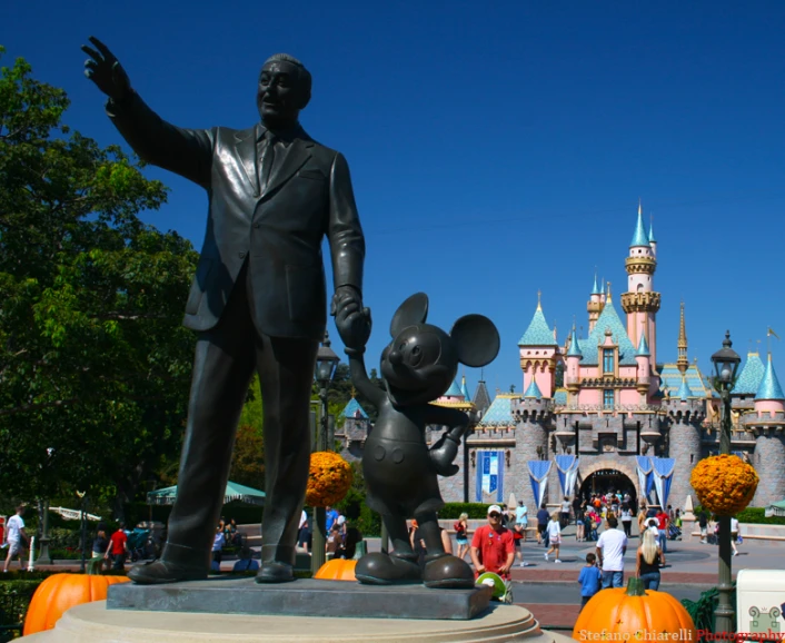 a large statue with a little mouse behind it