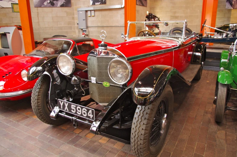 the three wheeled cars are on display in the museum