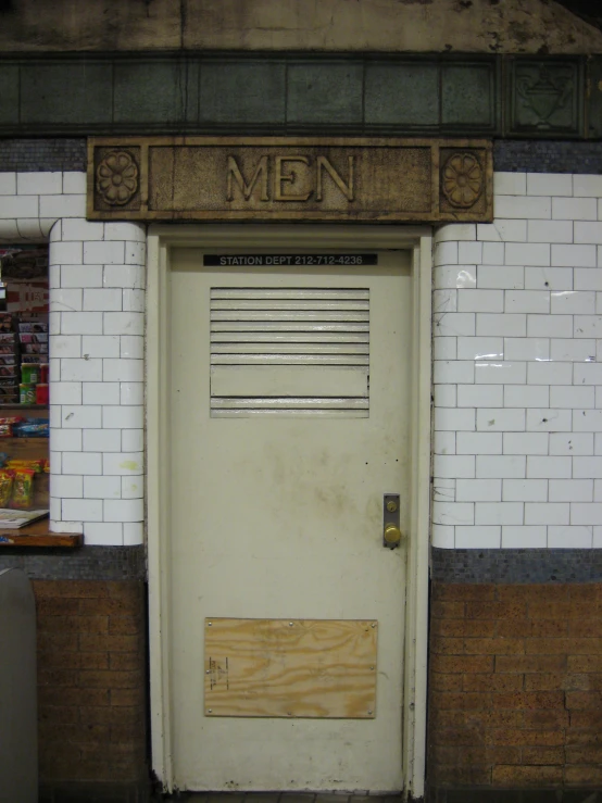 the door of the door to the mens'room is empty