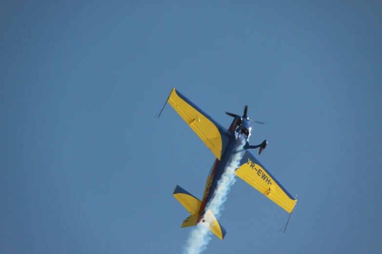 small plane doing stunt in the clear sky