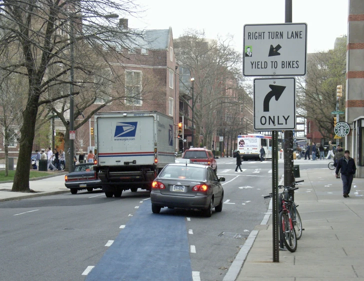 there is a post with a blue line going up the street