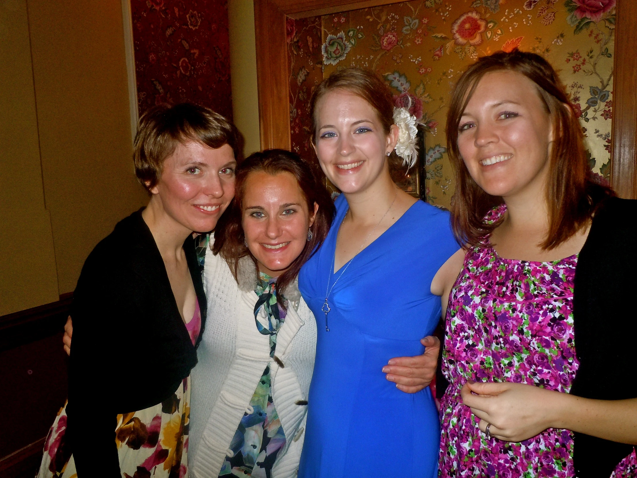 three women smiling at a camera together