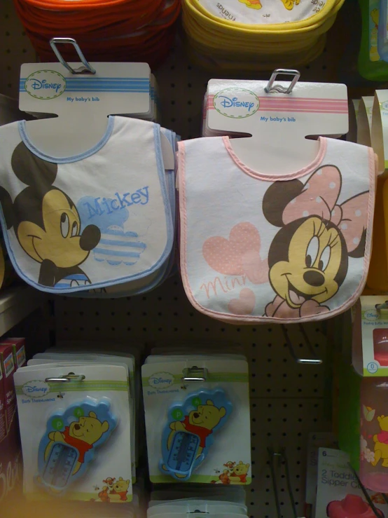 baby bibs and hats are on sale in a store