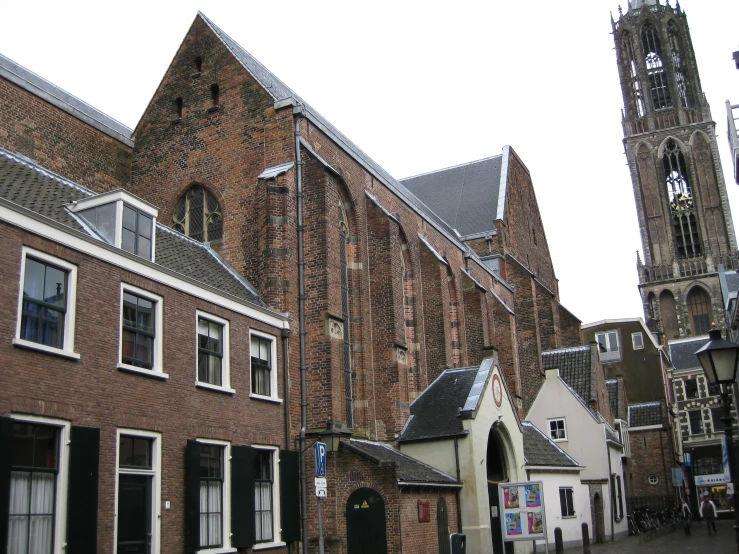 old buildings stand near one another near a church