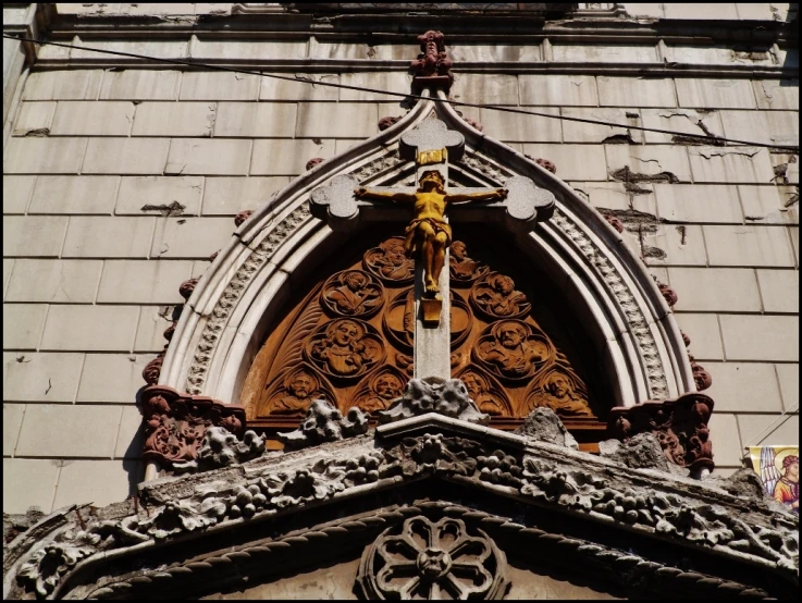 a church window with ornate carvings on the front