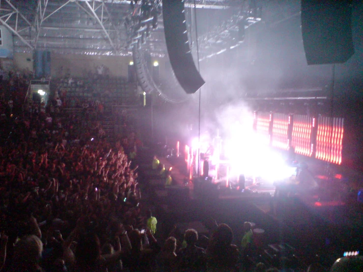 people watching a concert in the dark