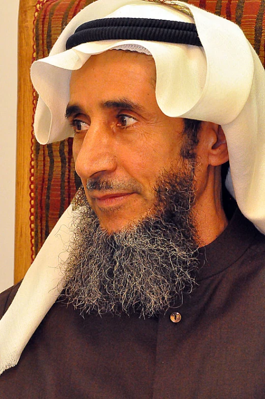 a man with a beard and a white turban