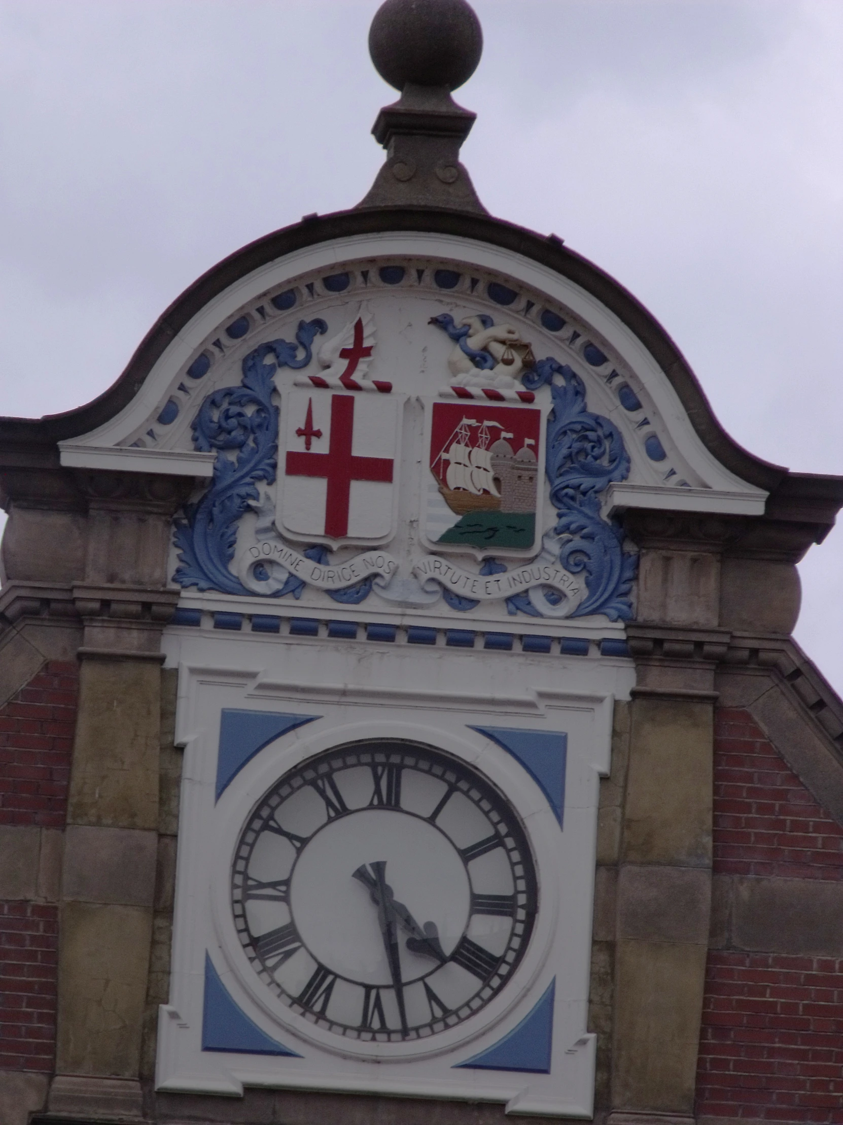 a clock has been decorated on the side of a building