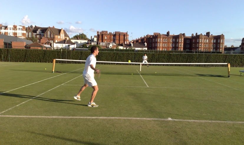 a tennis court with two men on it