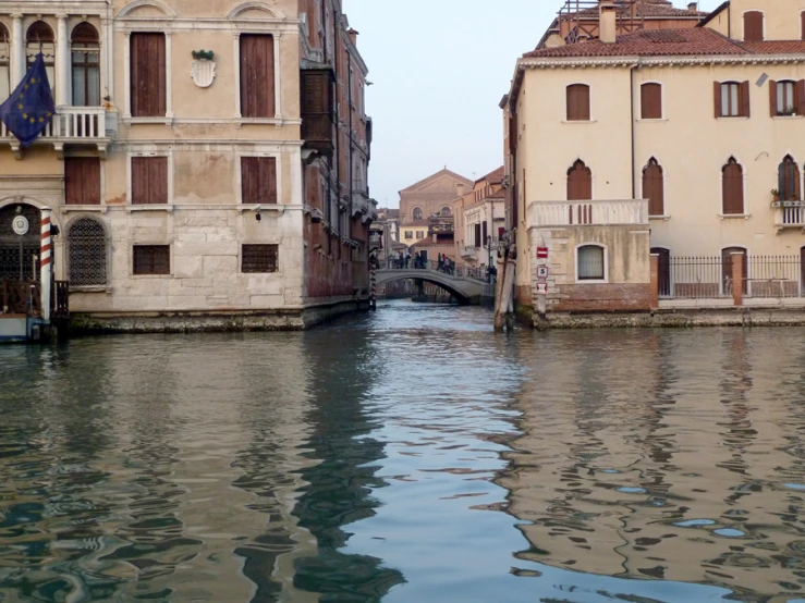 there are boats that can be seen sailing down the river