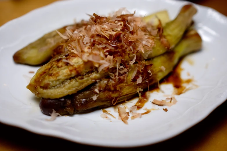 a dish with bananas and grated onions on top