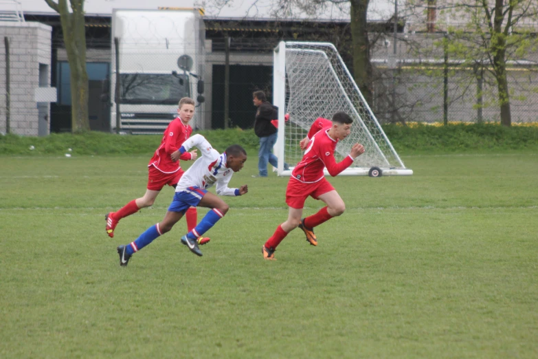 a group of s playing a game of soccer