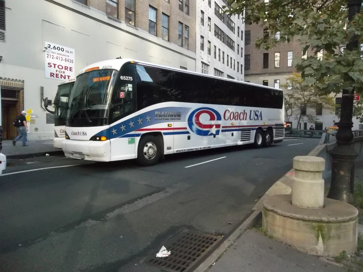 bus at the side of a city street