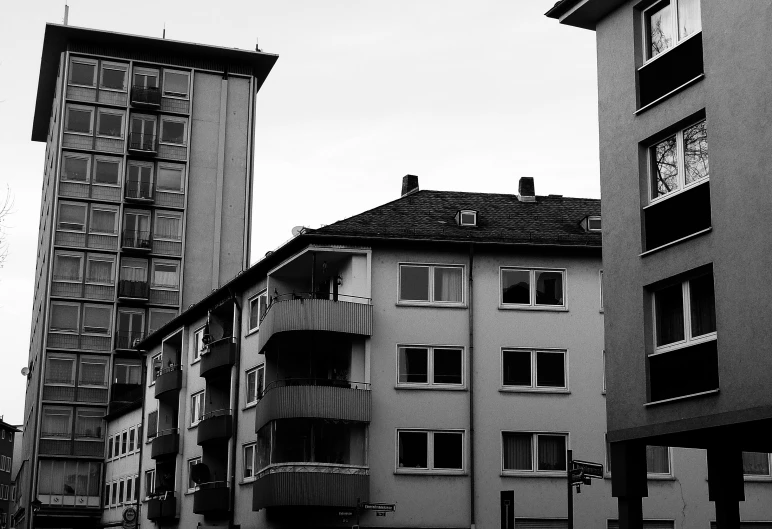 two building in the sky with one building on the other side and one with an umbrella