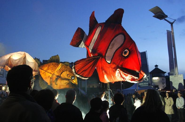 a float in the shape of an ocean animal on a street