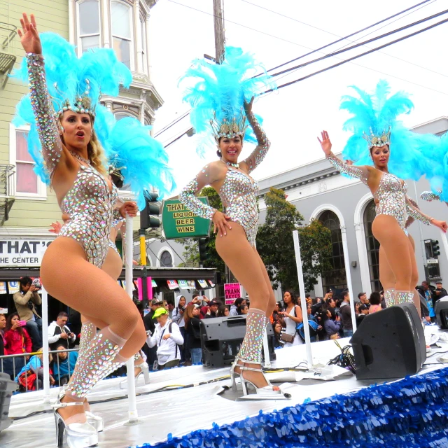 three beautiful women in lingerie dancing on a street