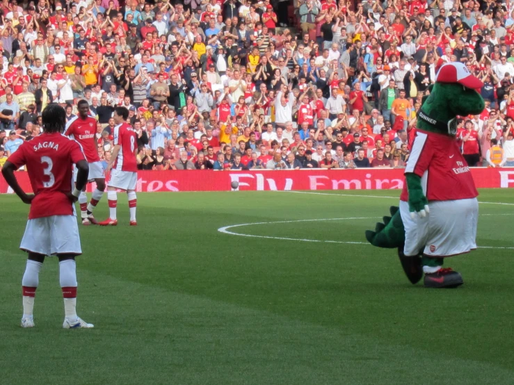 mascot of the chicago red sox playing soccer in front of an audience