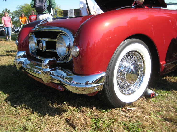 old model cars at a car show in the afternoon