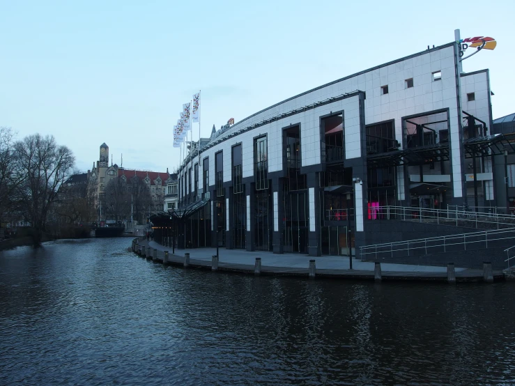 the building has a lot of windows along with water