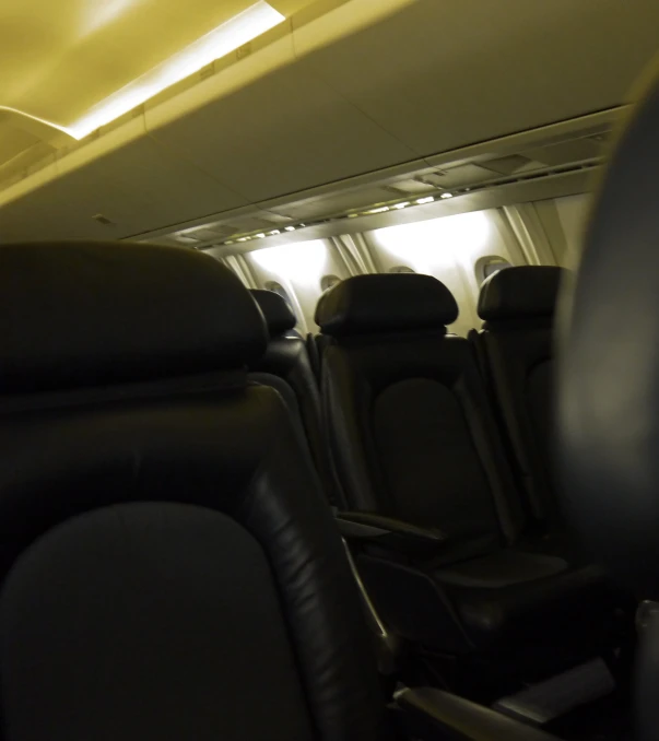 the cabin of an airliner with empty seats