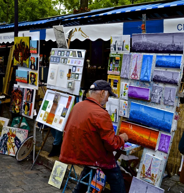 two men are browsing through an artist's shop