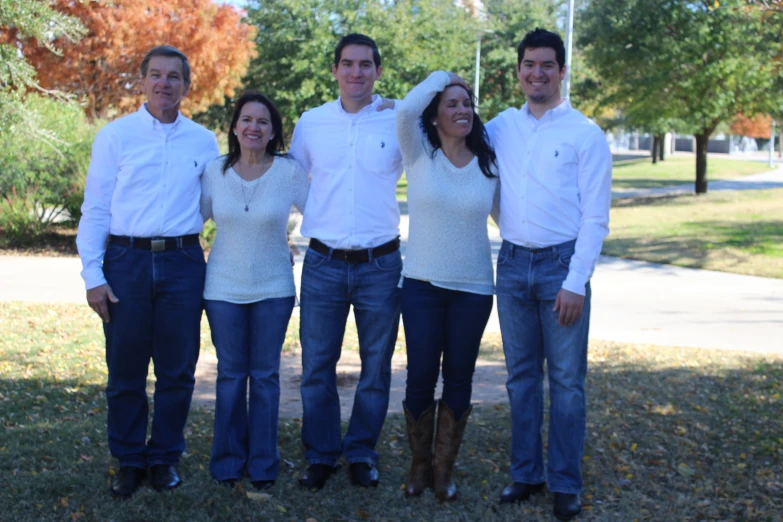 an image of a group of people that are standing in the grass