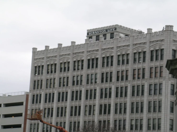 an industrial building in a city near other buildings