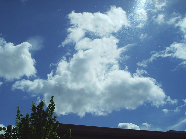 a clock tower and clouds in the background