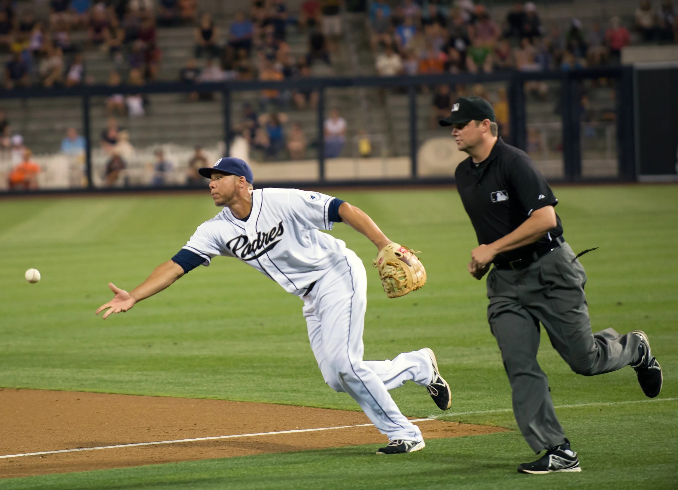 a man running to a base during a baseball game