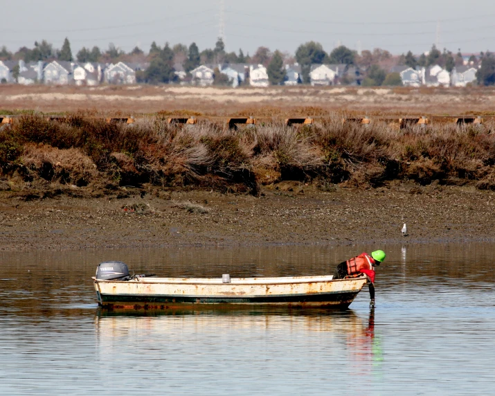 a small boat with a life jacket is on the water