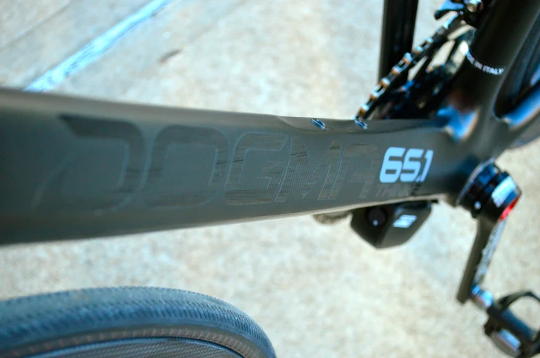 the front view of a black bicycle with white lettering