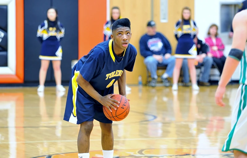 the basketball player in blue is ready to throw the ball