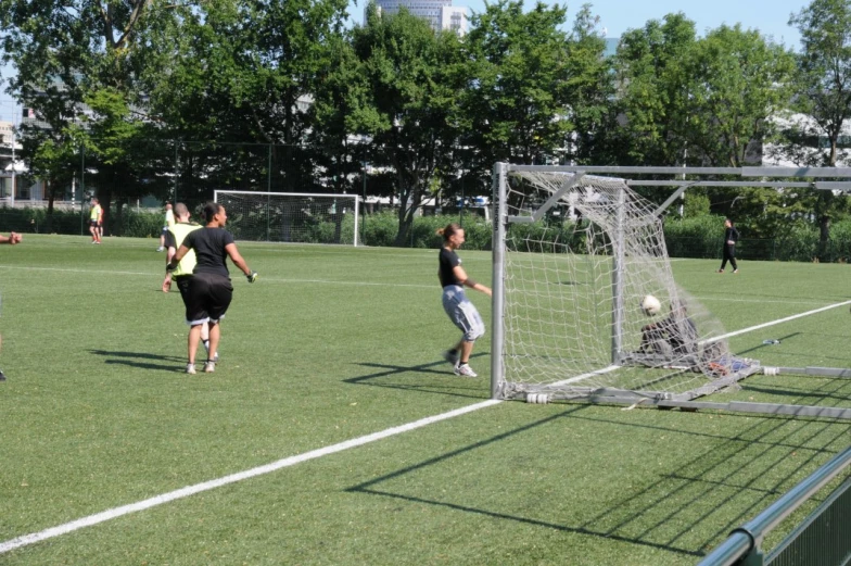 soccer players practicing on the green turf