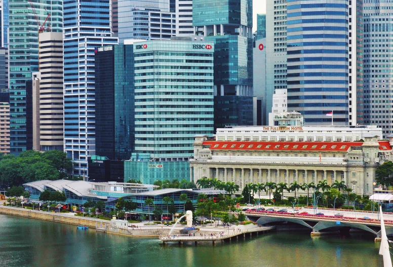 a city view with buildings on both sides and a large cruise ship