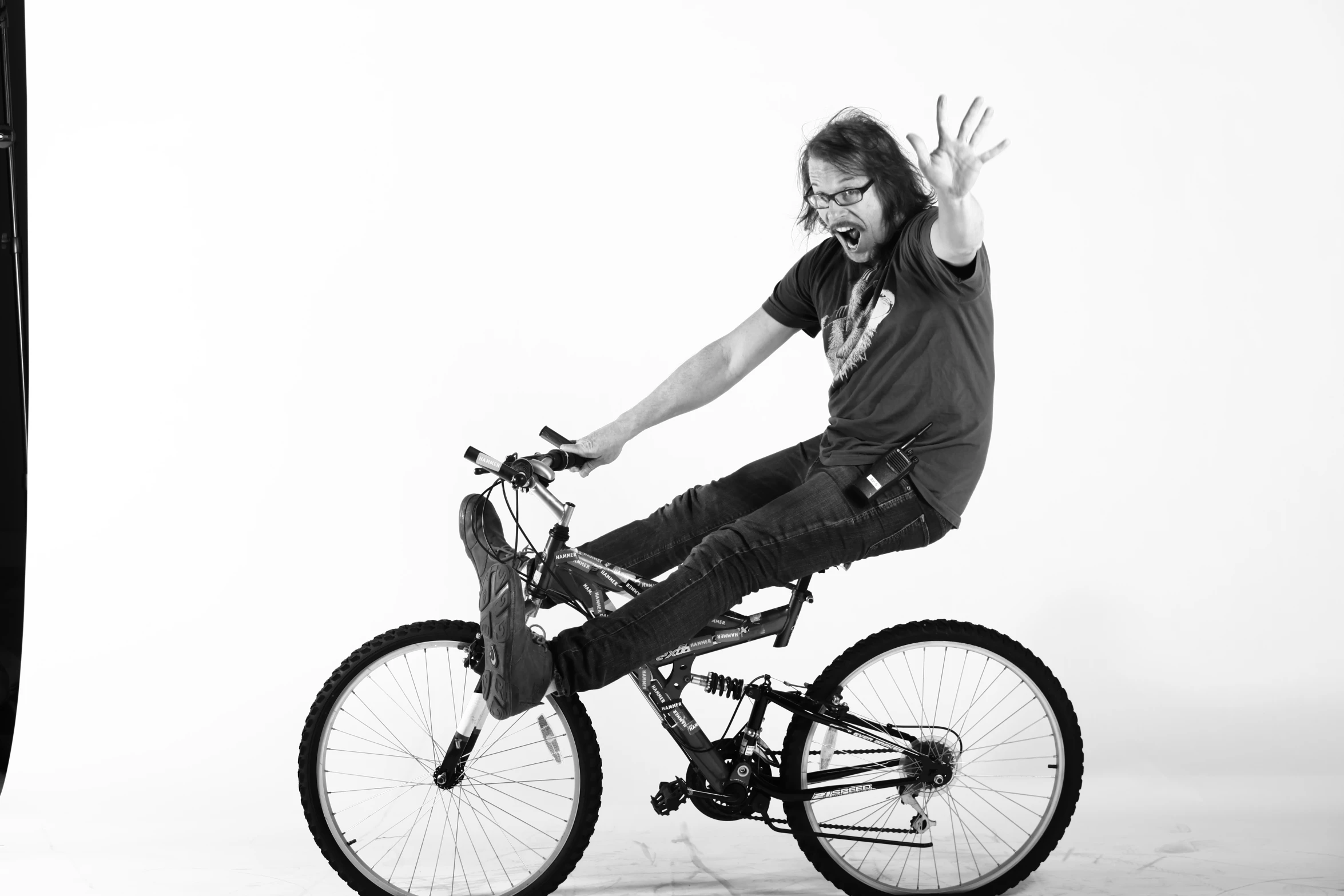 a man that is jumping in the air on a bicycle