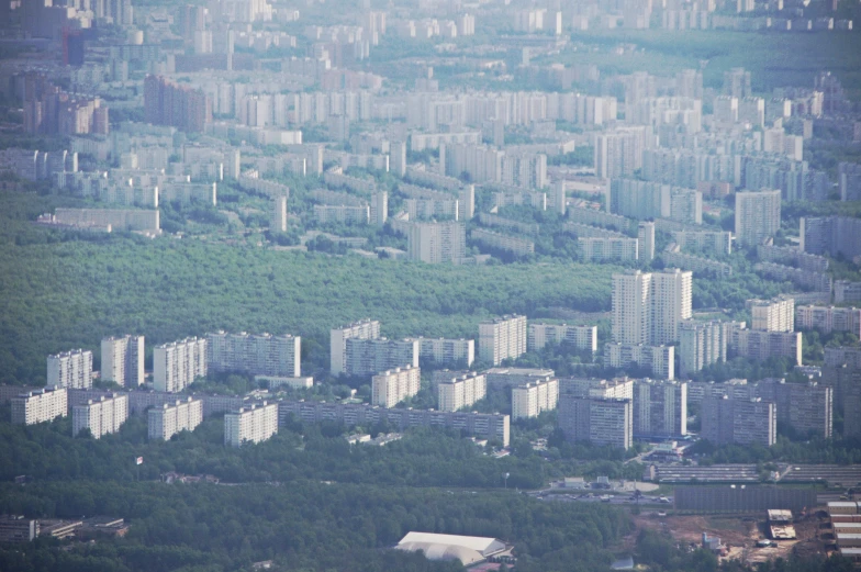 an aerial view of a city with tall buildings