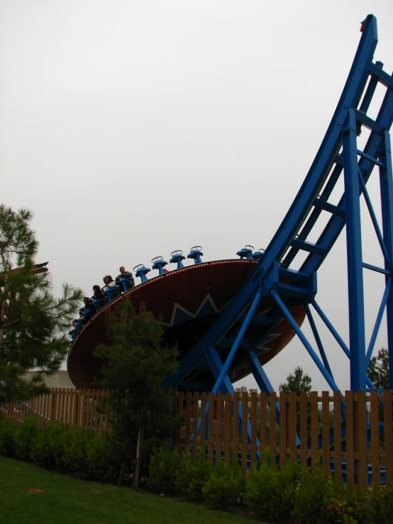 a ride with people inside at a theme park