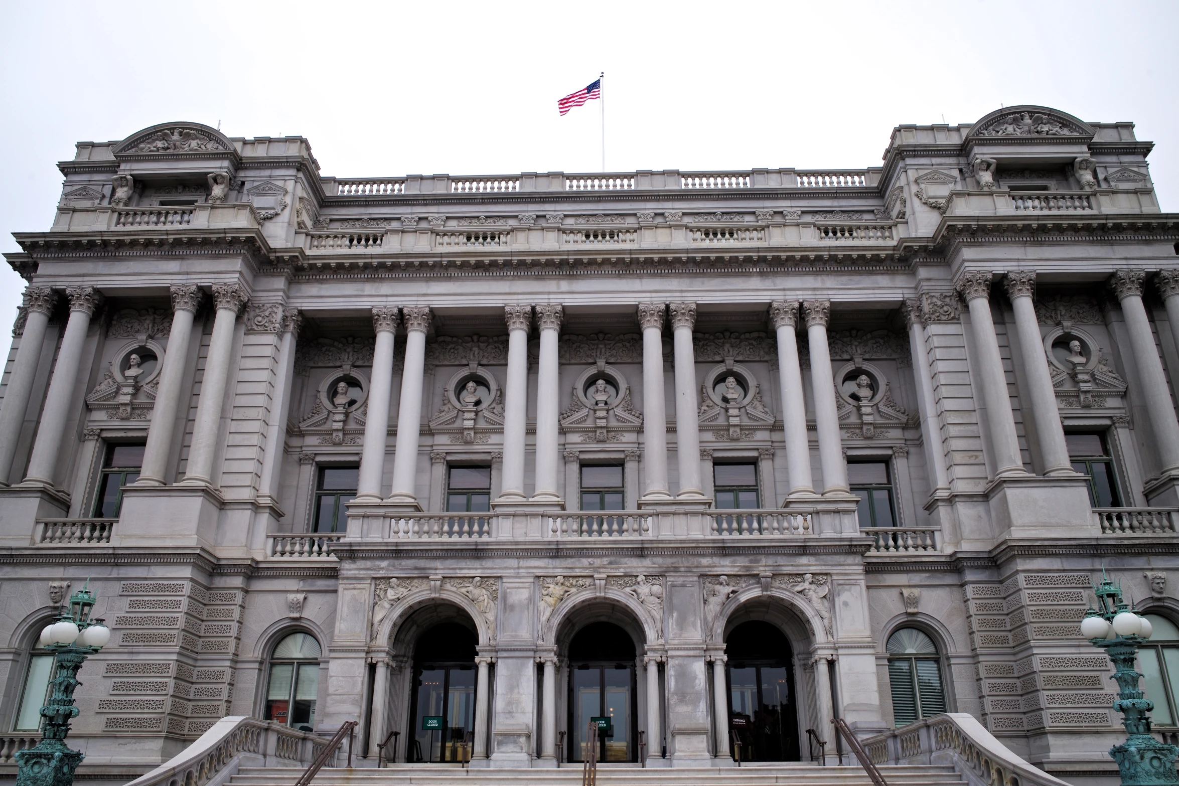 an ornate stone building has columns and pillars