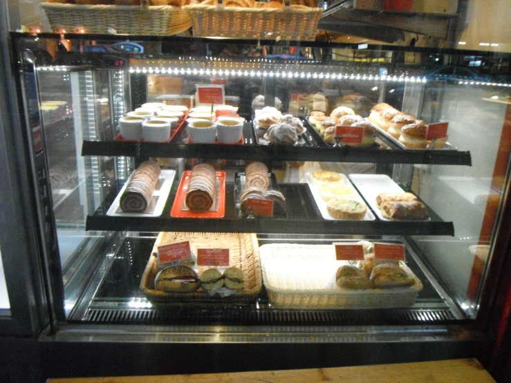 the display case features delicious, fresh baked treats