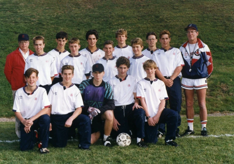 a group of men in white and red soccer uniforms