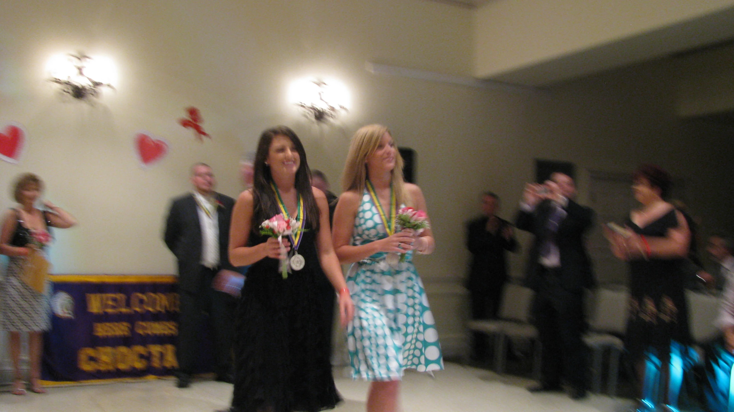 a group of women walking down a dance floor