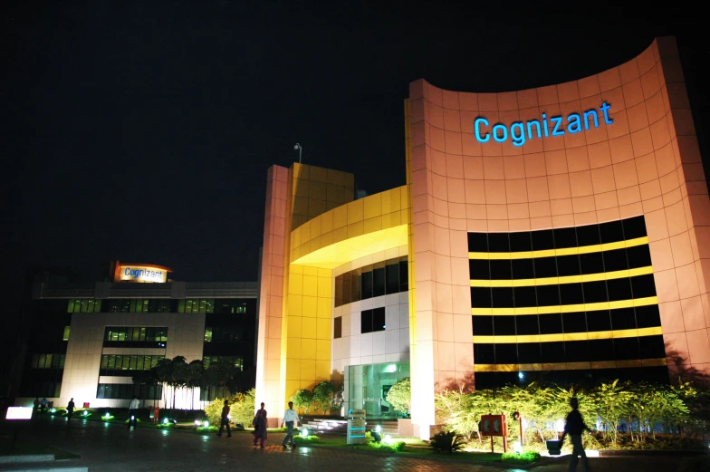 the bright facade of a large building with a blue and white word on it