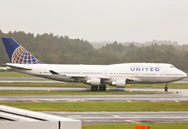 a large united passenger jet on the runway