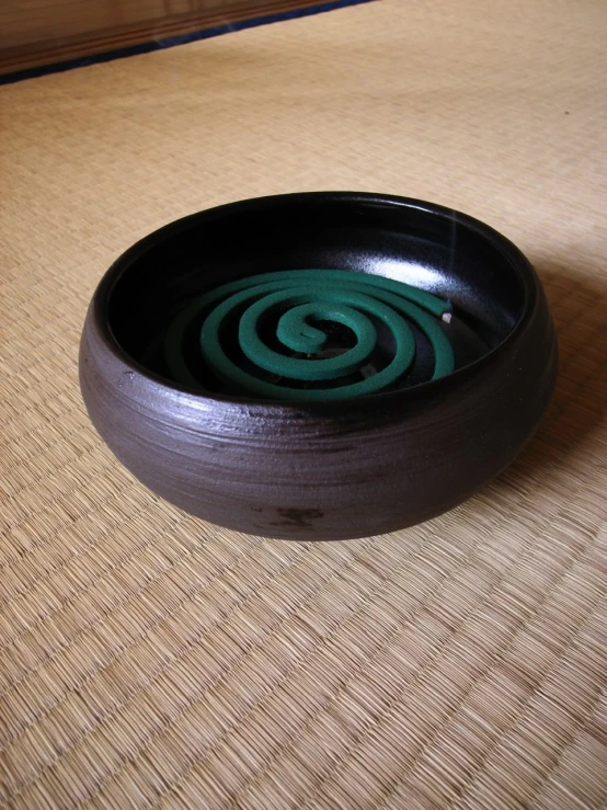 a bowl on the table with an unusual swirl inside