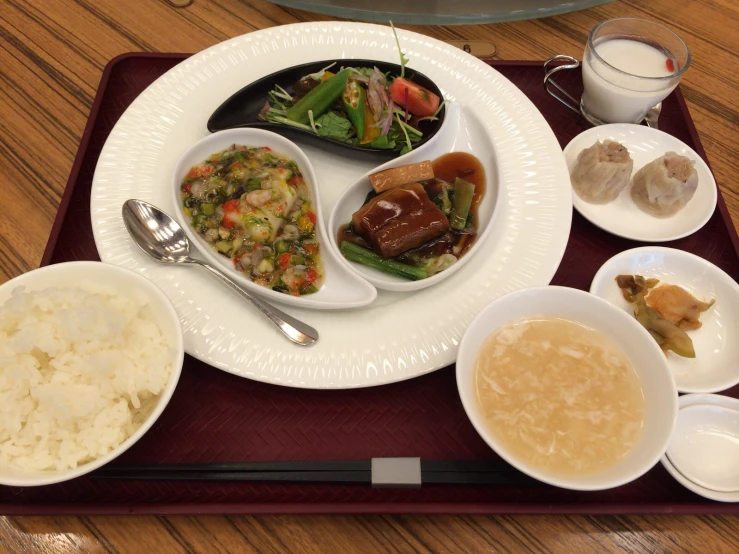 a tray full of plates with different foods