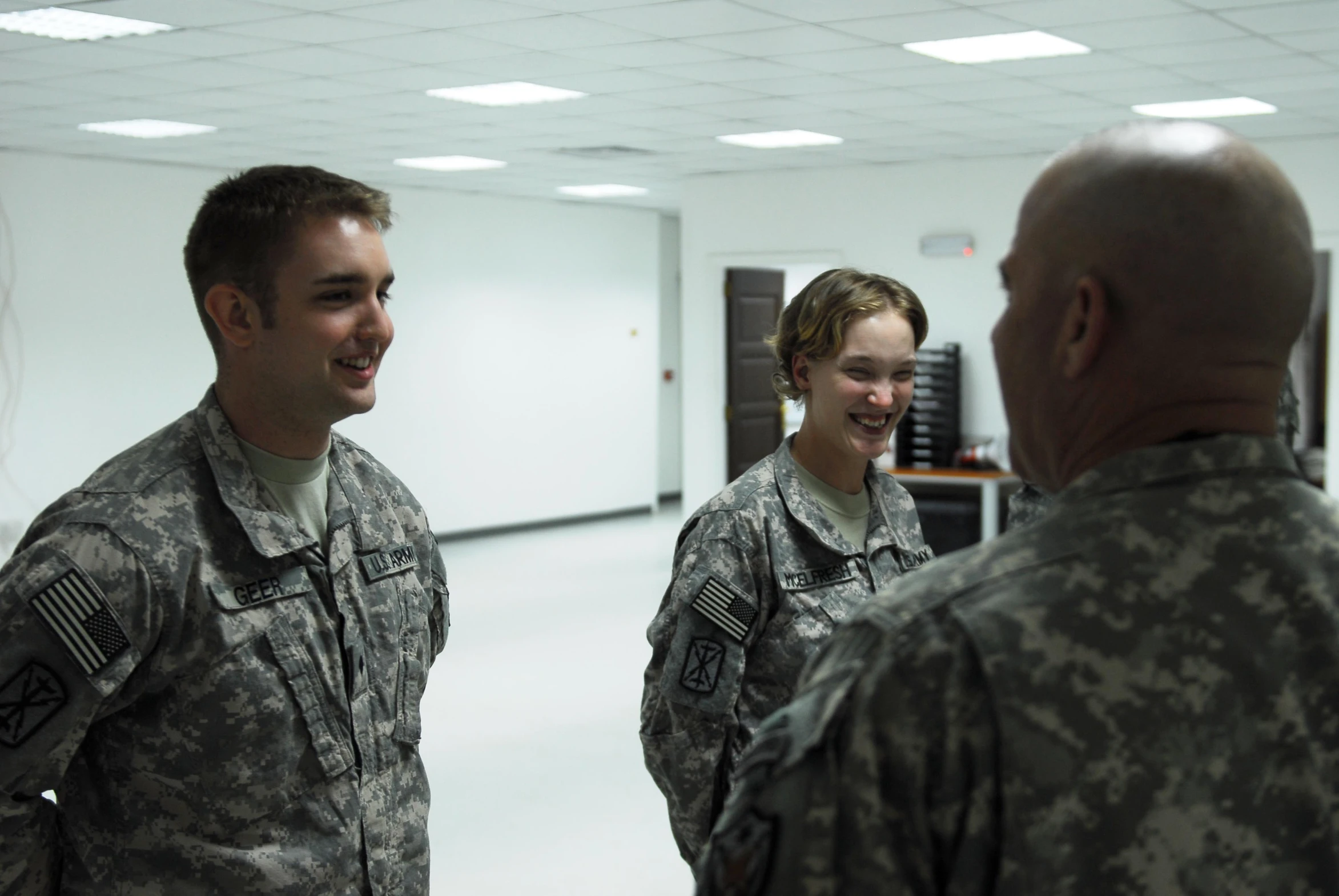 a group of soldiers with one talking to the other