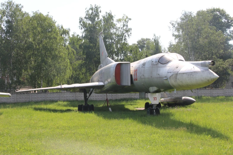 two airplanes that are on the grass